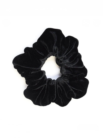 Rochelle Black Velvet Scrunchie offers a secure hold with soft velvet material, perfect for styling a comfortable, chic messy bun