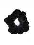 Rochelle Black Velvet Scrunchie offers a secure hold with soft velvet material, perfect for styling a comfortable, chic messy bun