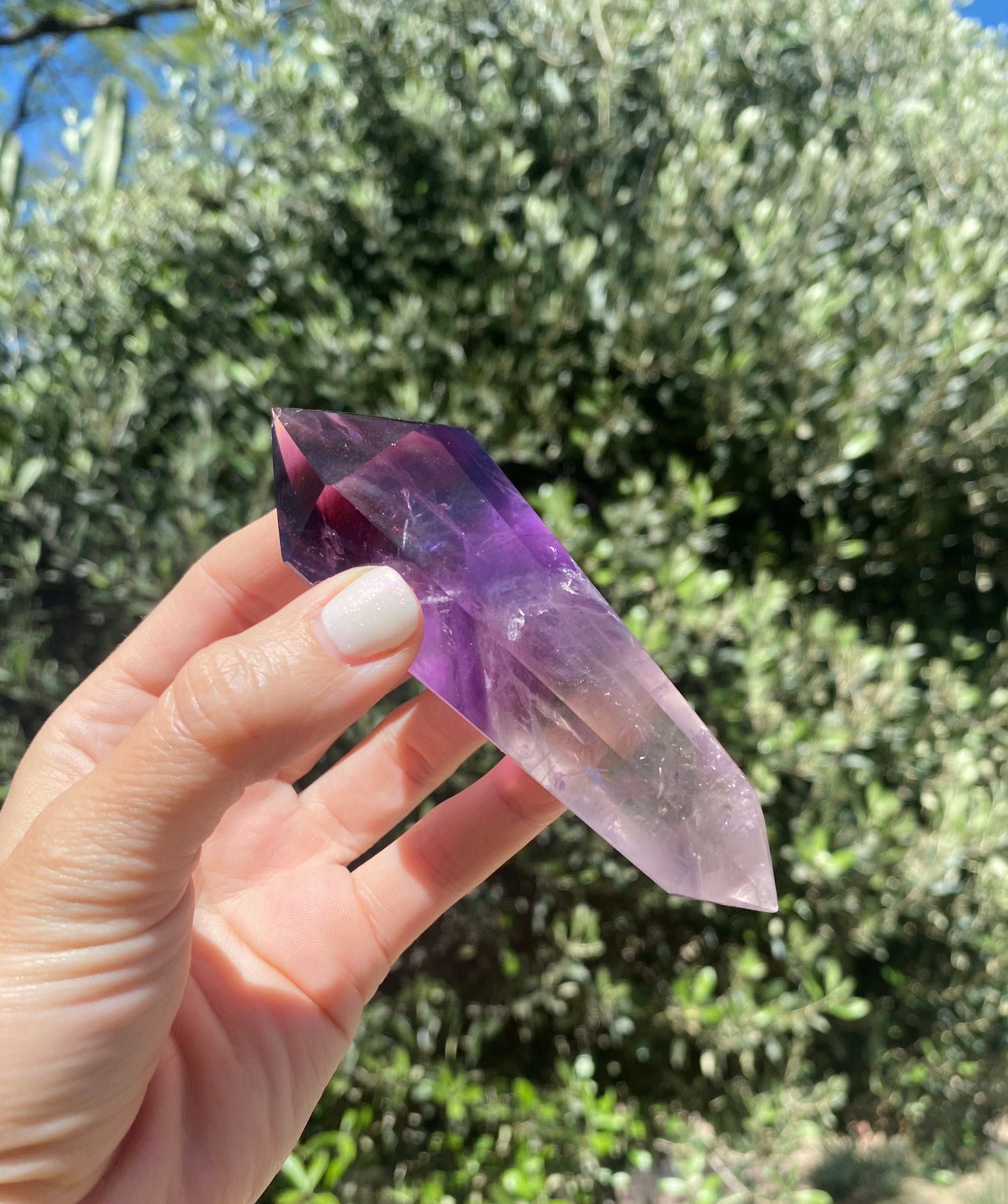 amethyst double point crystal, a tool for energy balance, spirituality, and connection with the divine, third eye and crown chakra