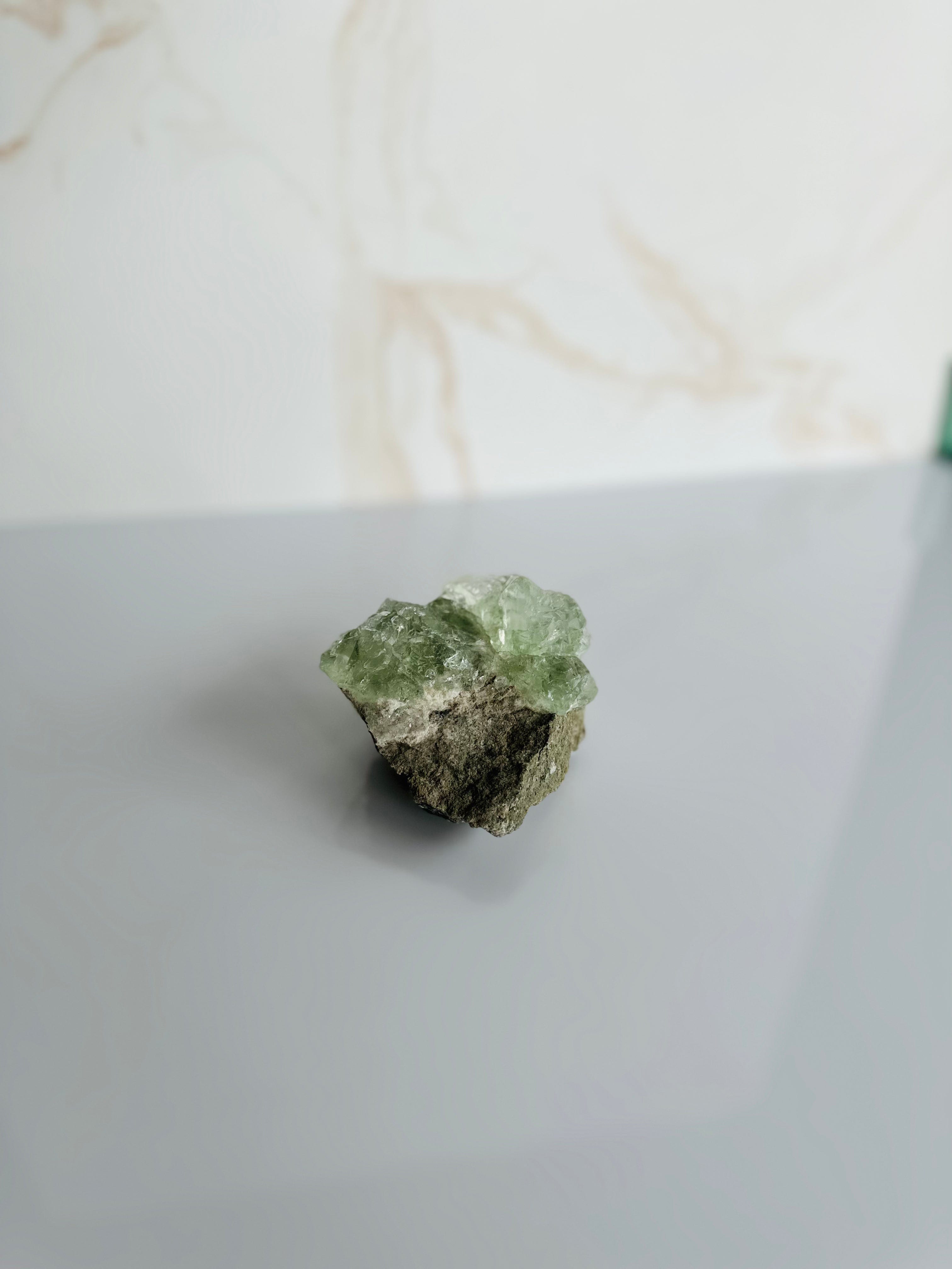 Up close, the Raw Fluorite reveals stunning shades of green and purple, enhancing its beauty while promoting mental clarity and peace