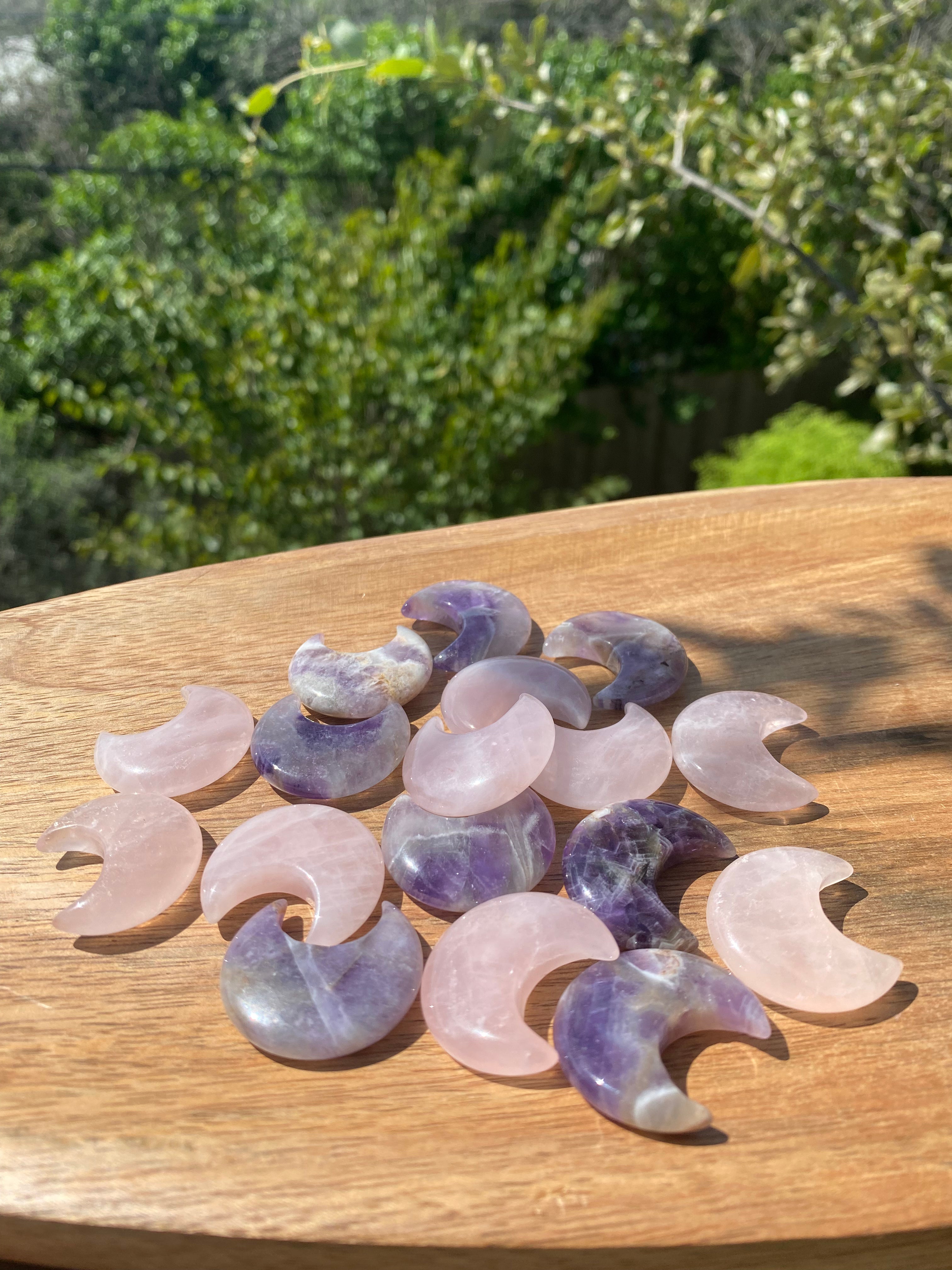 Moon Carved Pocket Stones in Rose Quartz and Amethyst, designed to balance energy, reduce stress, and promote emotional well-being