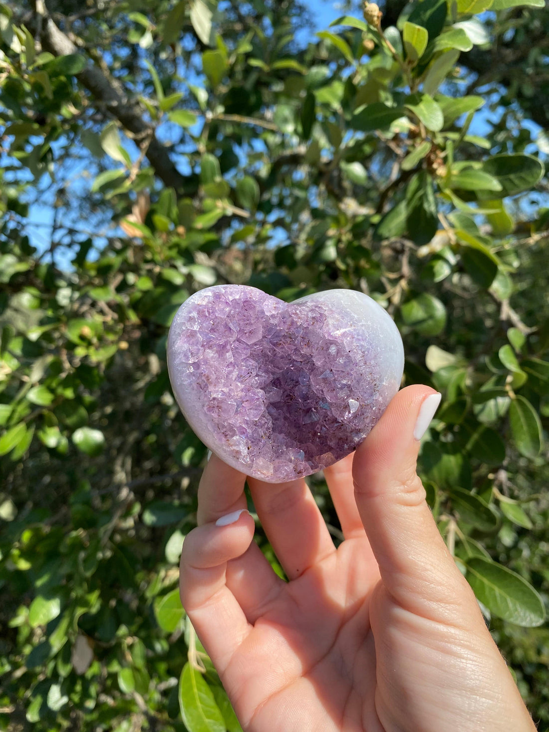 Amethyst crystal heart wrapped in baby blue Brazilian Agate, promoting balance and protection.