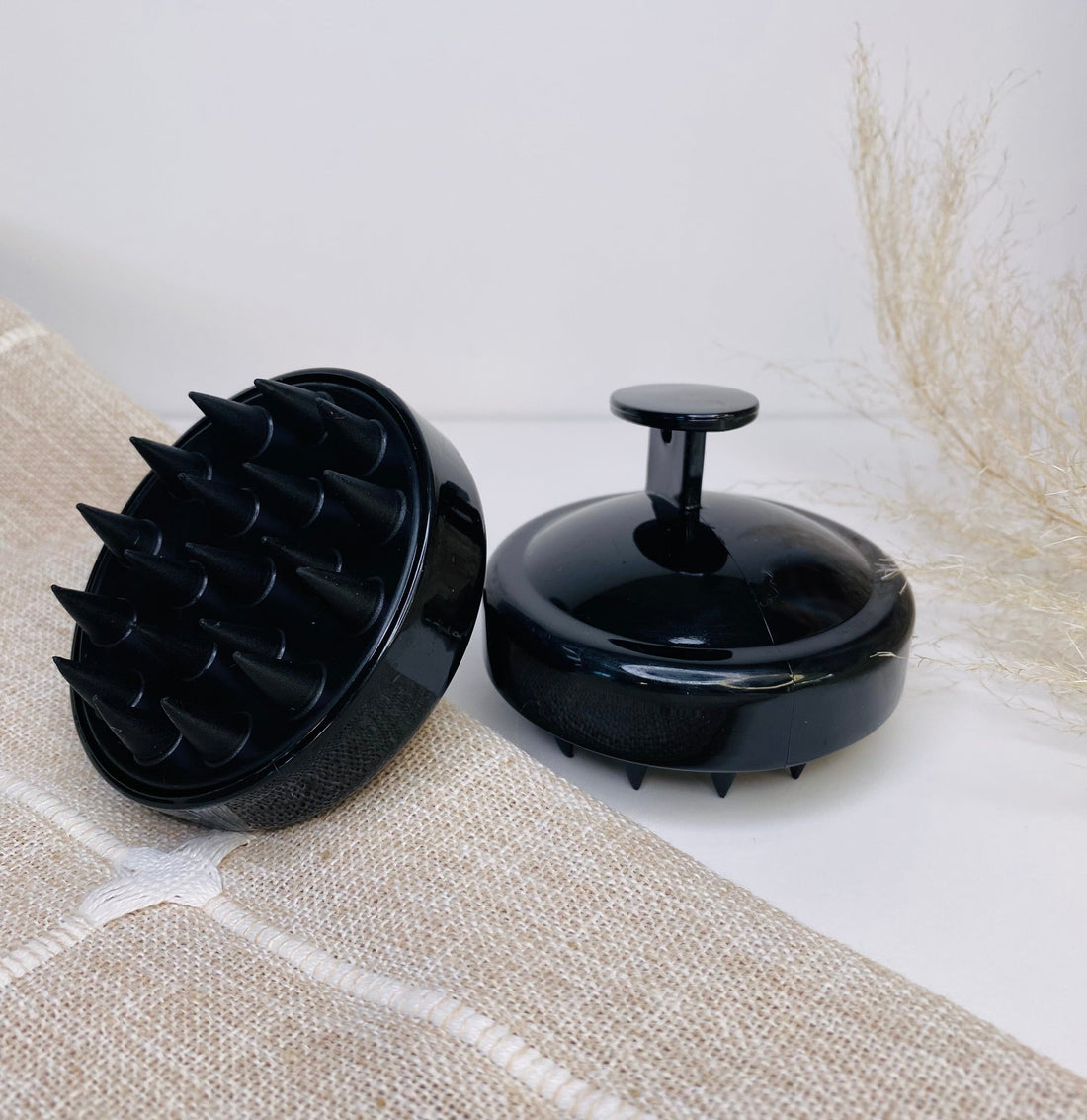 Audrey shampoo brush with soft scrubbers, designed to exfoliate, stimulate, and deep clean hair and scalp.