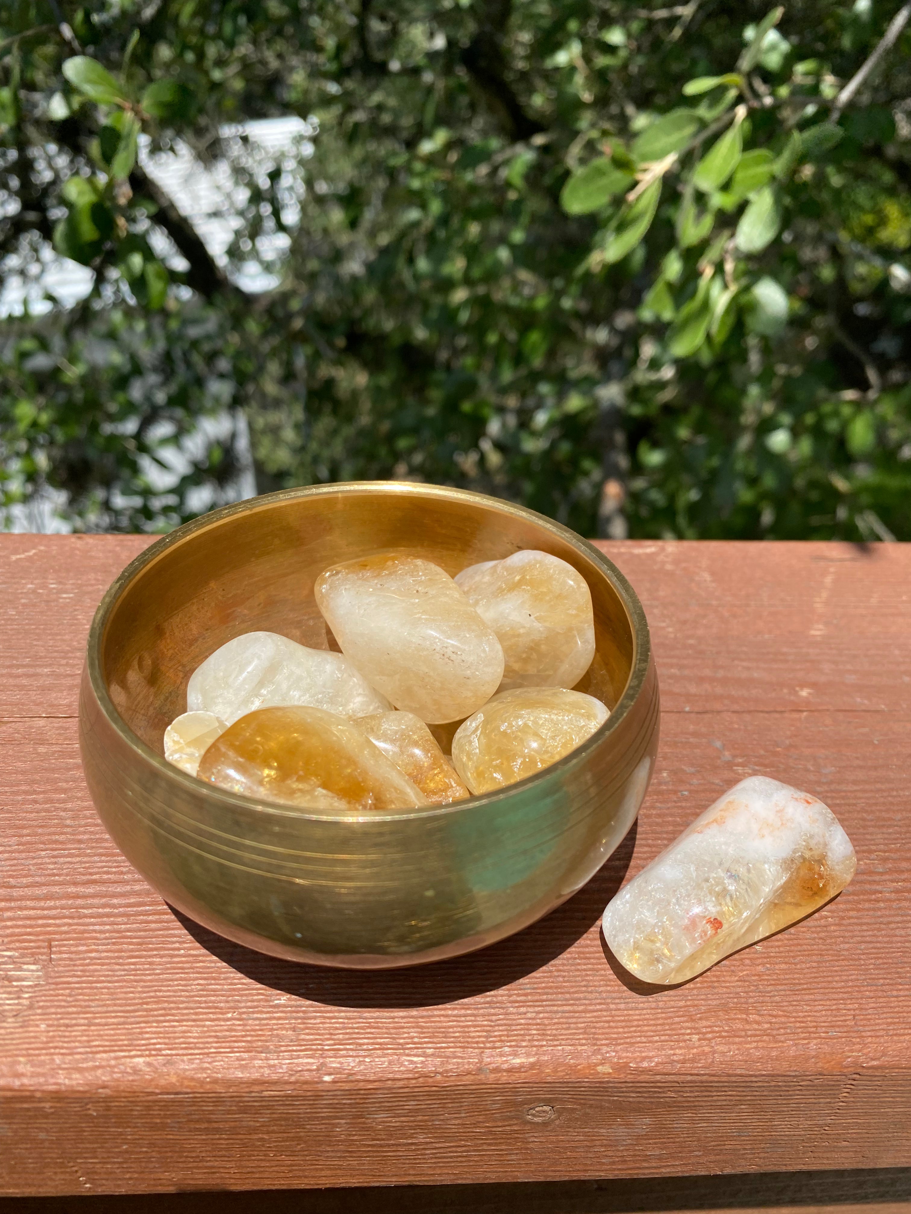 Citrine tumble stone, uplifting mood and boosting confidence with its sunny energy, perfect for overall well-being