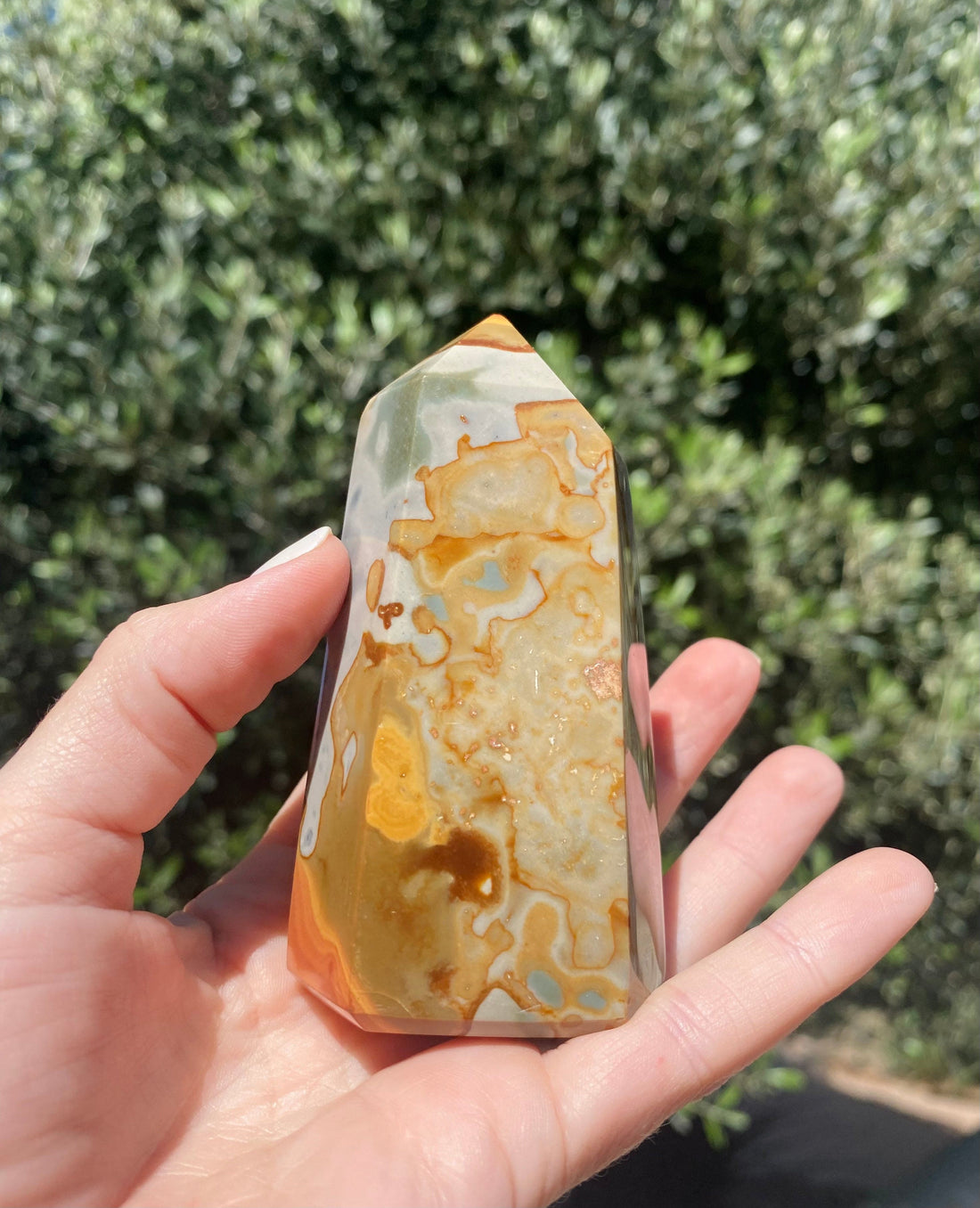 Hold the Uruguayan Jasper with Agate Tower to experience its calming, nurturing energy and balance in your hands