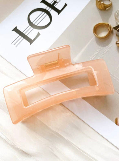 Pink Jelly Claw, designed to hold thick hair with ease, featuring a retro style and vibrant color for a fun addition to your bundle!