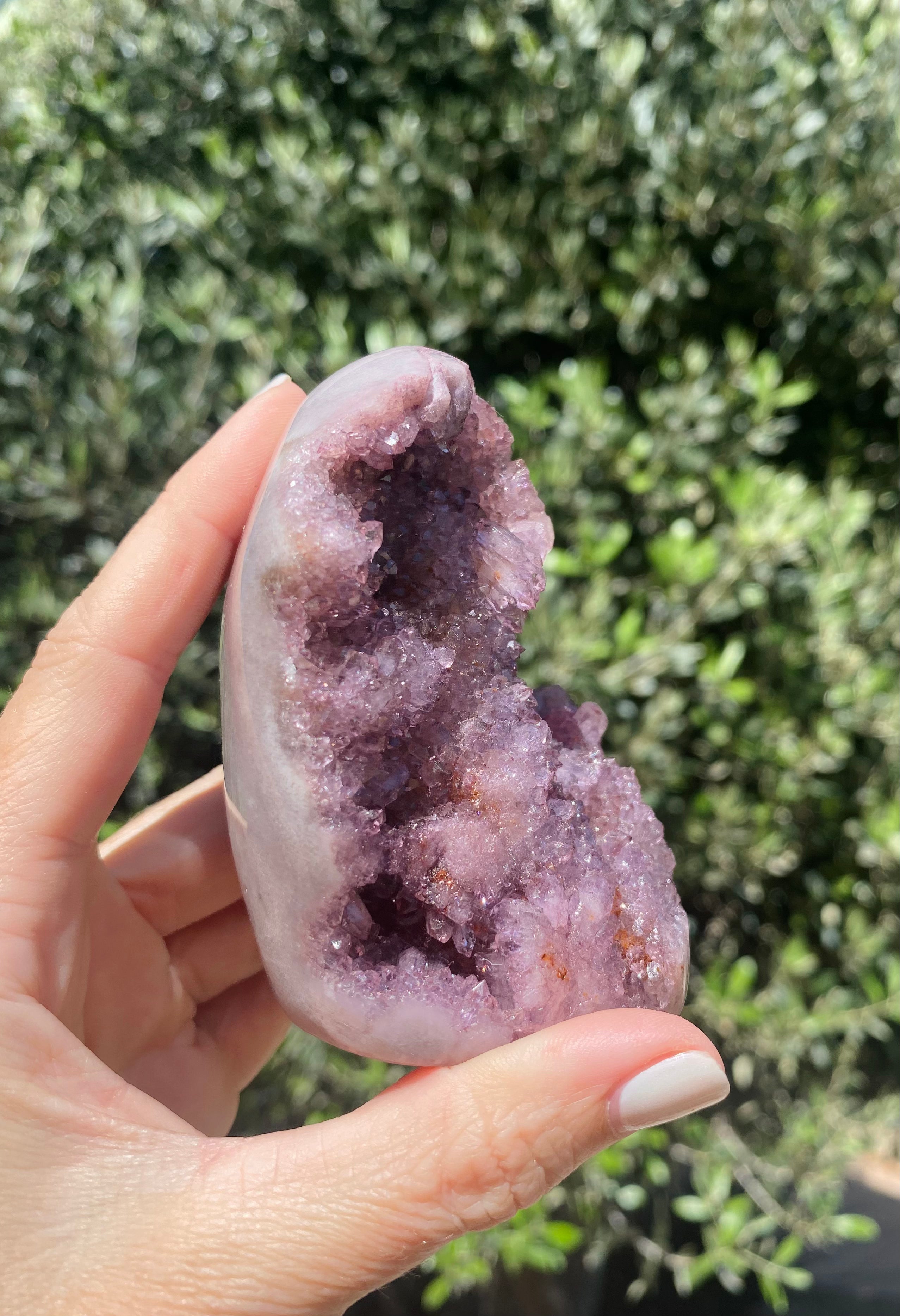 Rose & Amethyst Quartz glows under sunlight, showcasing its beautiful blend of pink, lavender, and purple tones, perfect for love.