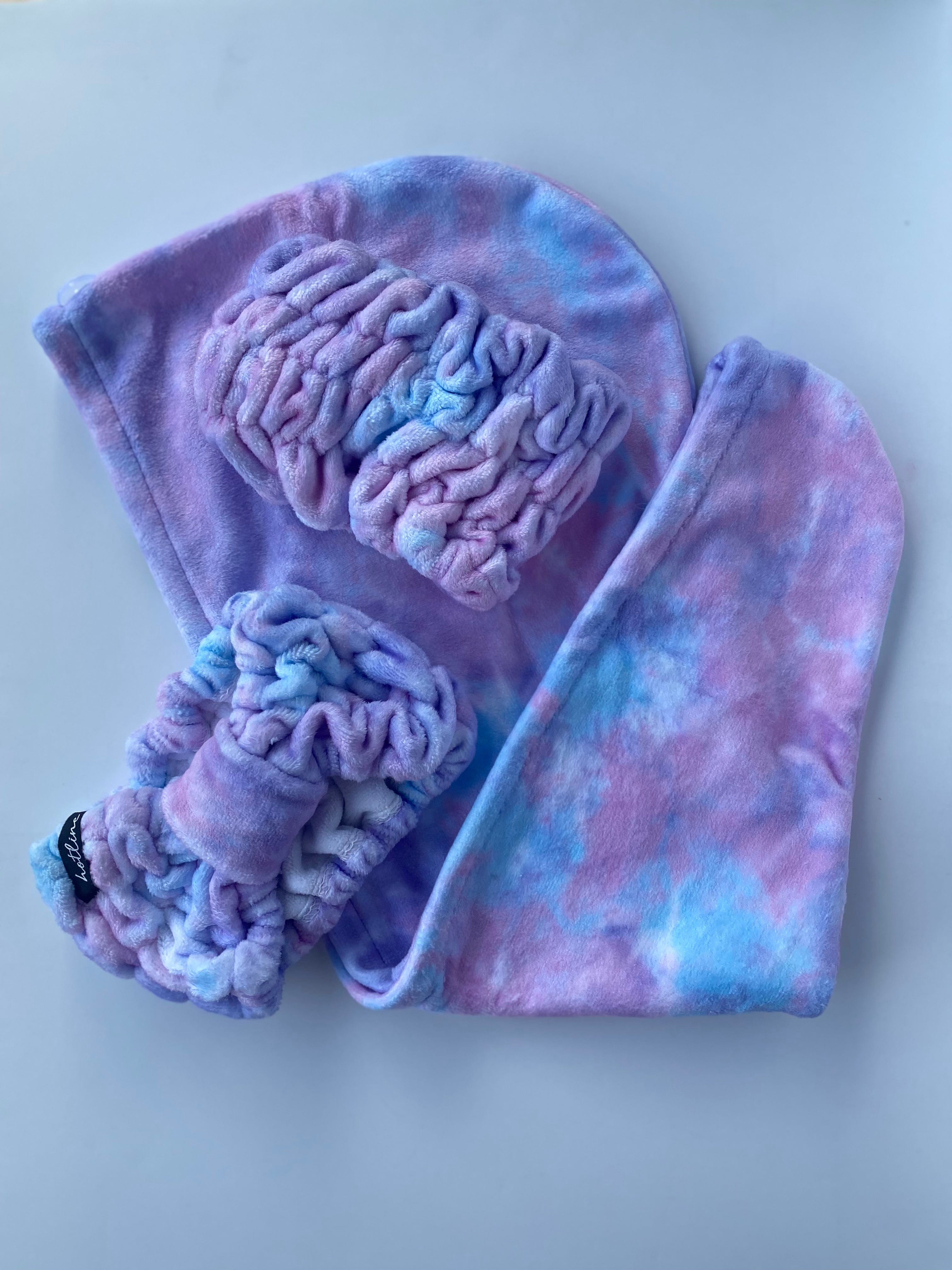 Wrap your hair in the Purple Tie Dye Trina Towel Twist, perfect for reducing frizz with its super-soft microfiber