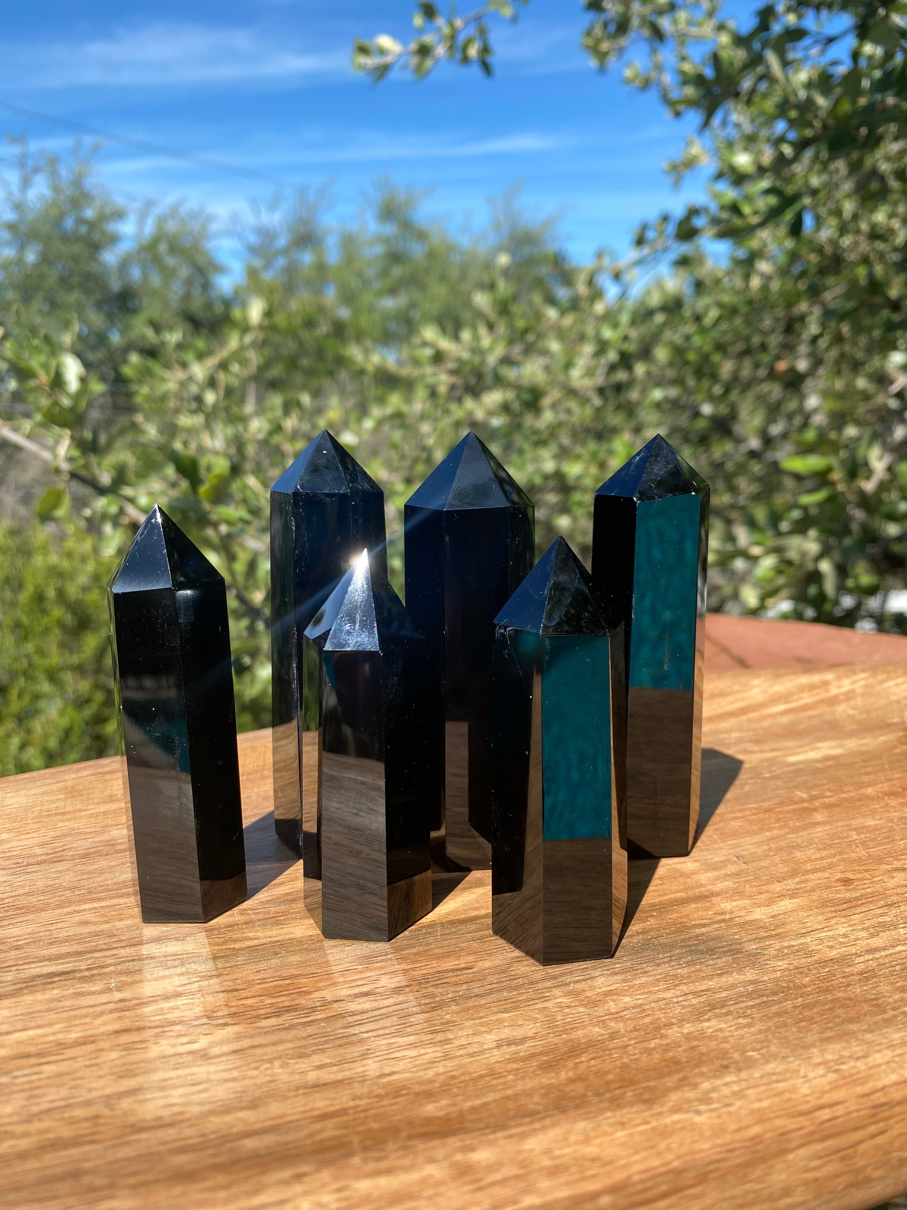 This smooth Obsidian Tower is highly protective, connected to the root chakra, and known for absorbing negativity and promoting self-awareness
