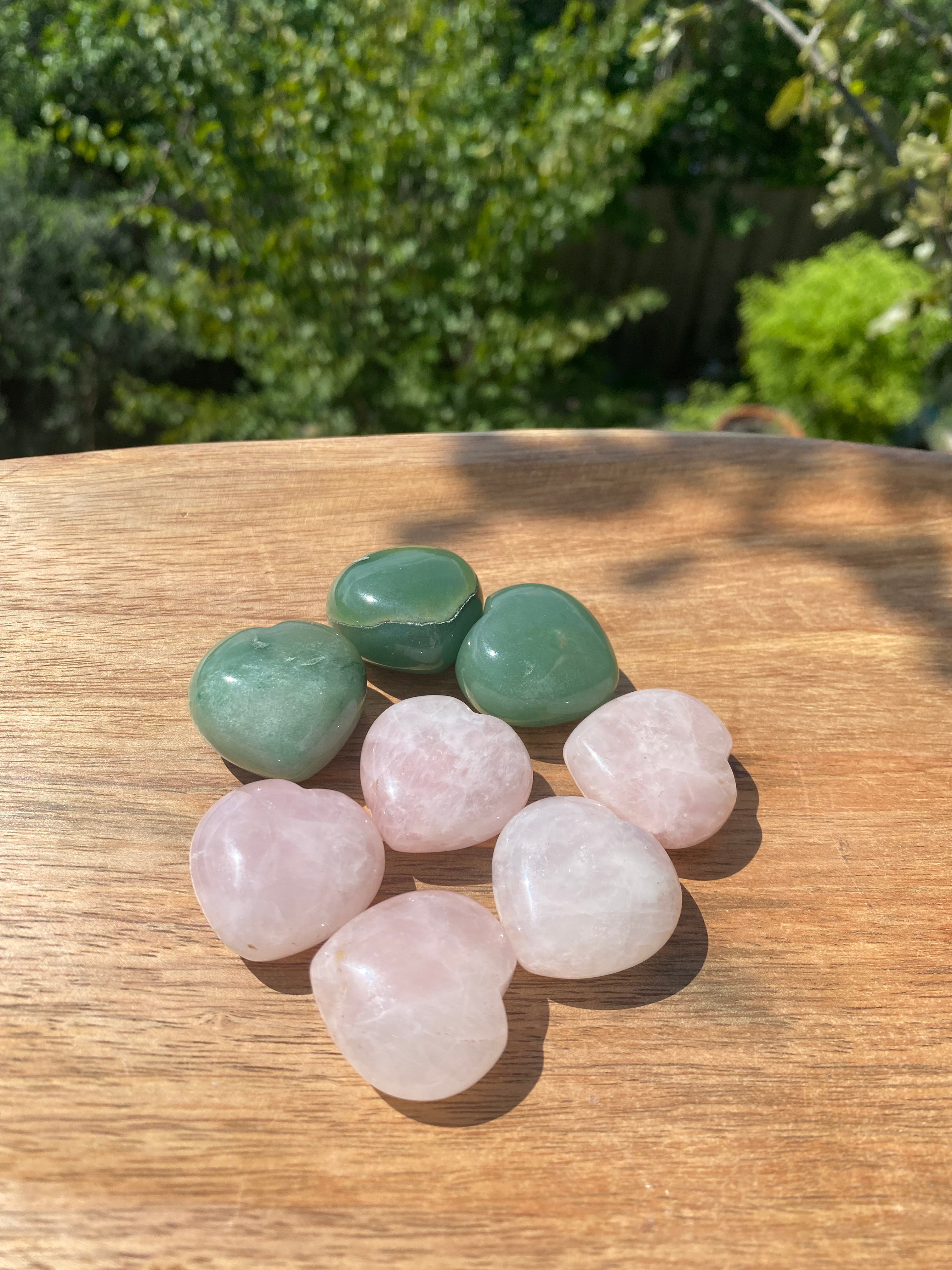 Green Afghan Jade Point crystal with swirling greens and whites, providing heart chakra alignment and protection from negative energy