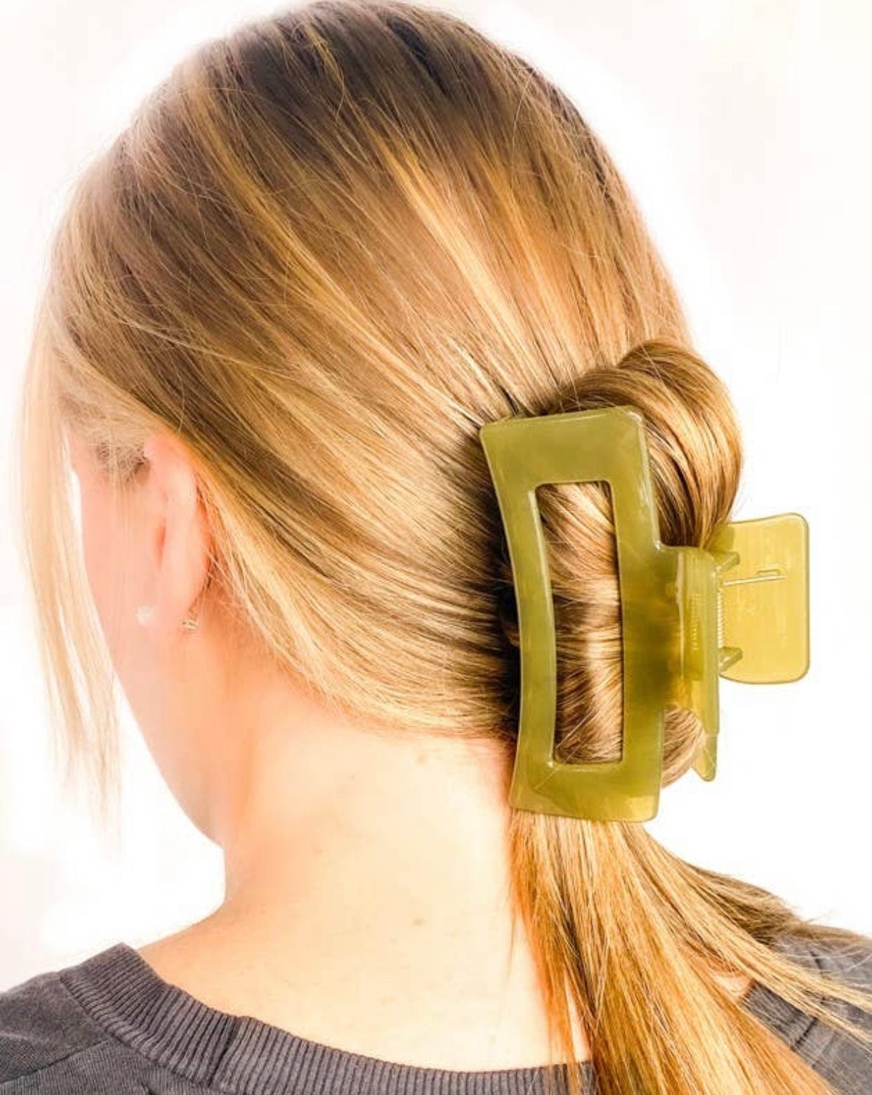 Jelly Claw, made for thick hair with a fun retro vibe, available in vibrant colors like olive, pink, orange, and clear