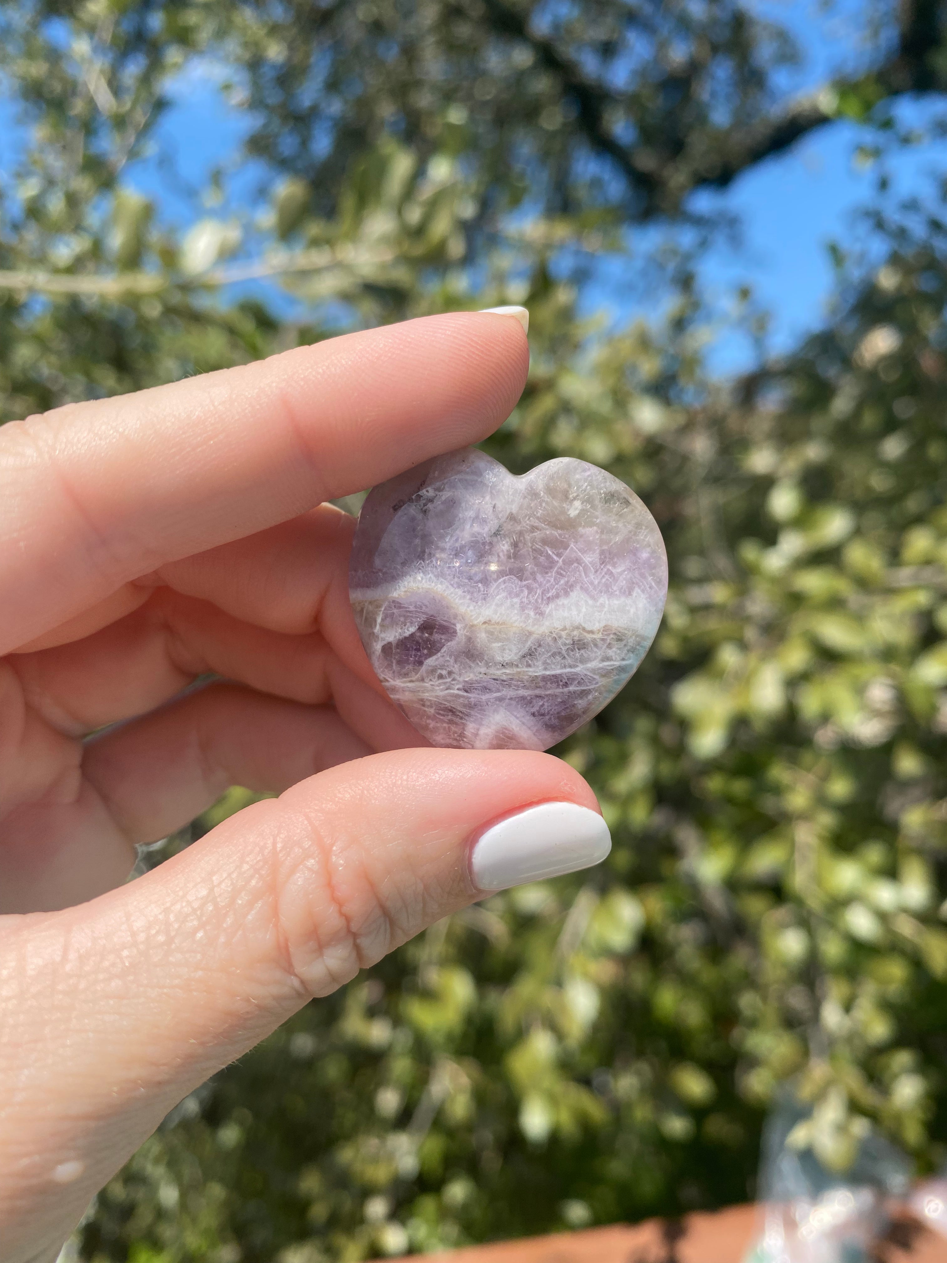 Amethyst heart, a natural tranquilizer, relieves stress and anxiety while balancing mood swings and enhancing spiritual awareness