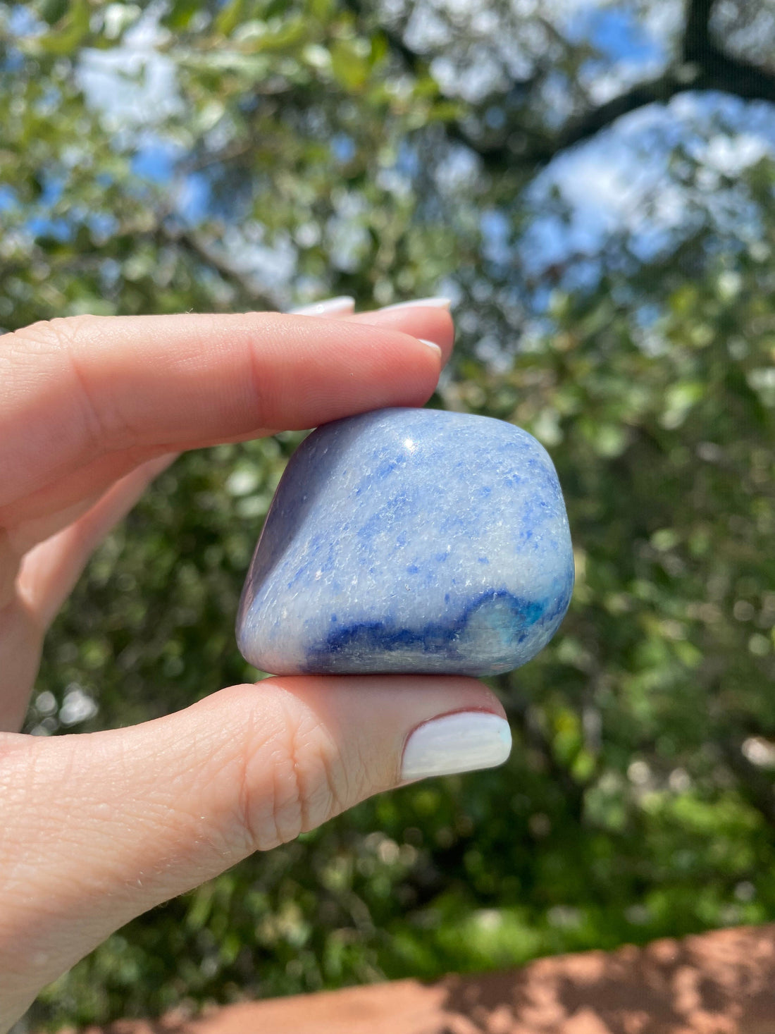 Blue Aventurine tumble stone, resonating with the Throat and Third Eye Chakra, promoting self-discipline and inner strength
