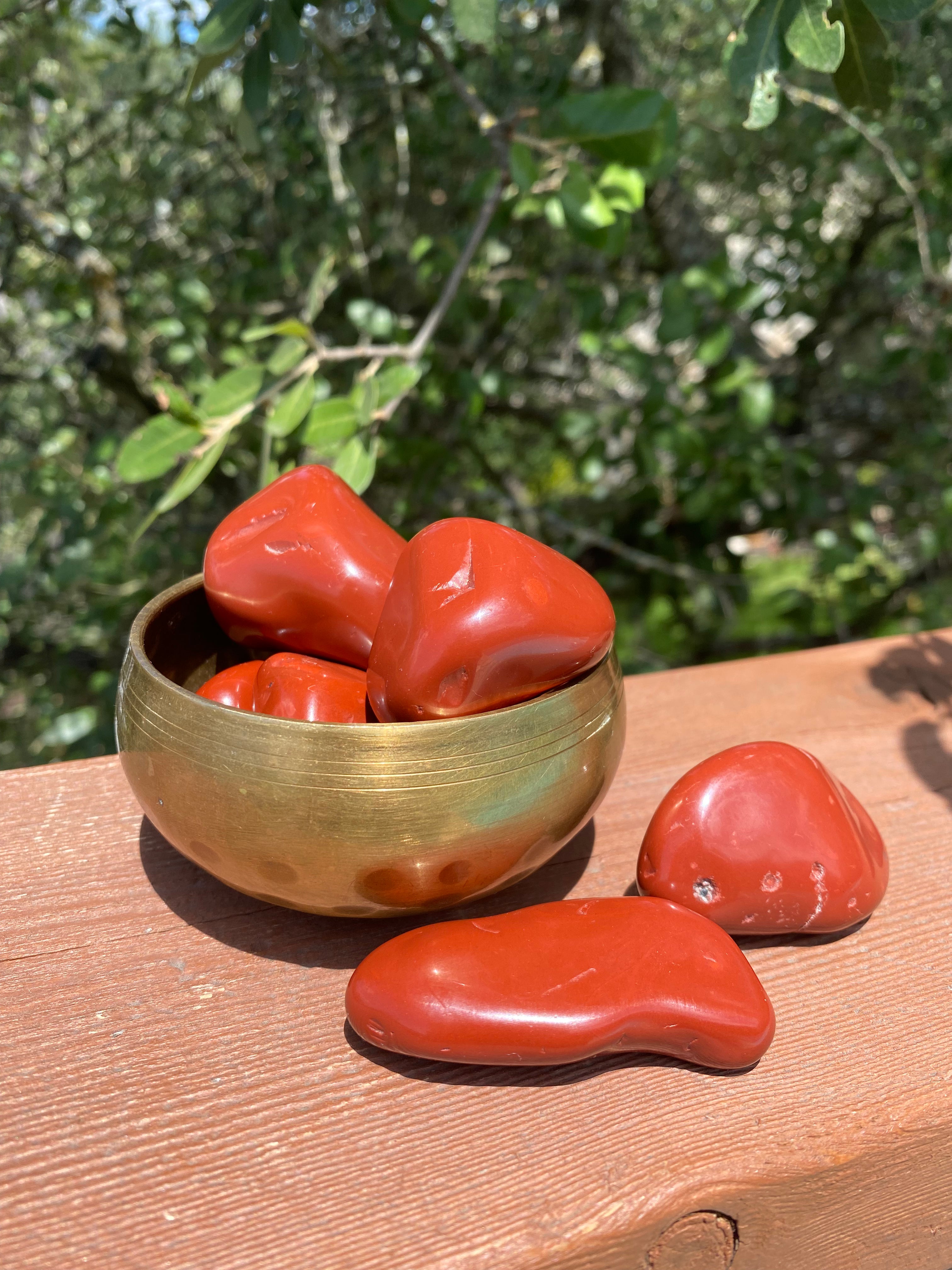 Vibrant Red Jasper shines under sunlight, aligning with the root chakra, enhancing endurance, and stabilizing energy