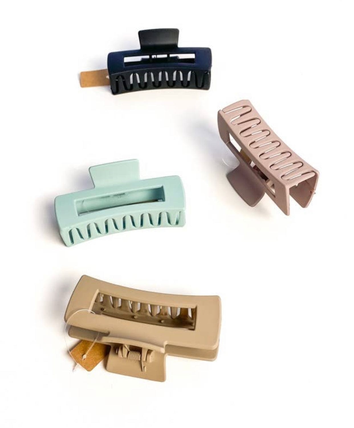 Sophie Matte Claw clip with a soft matte finish, available in black, camel, soft pink, and teal, designed to hold even the thickest hair