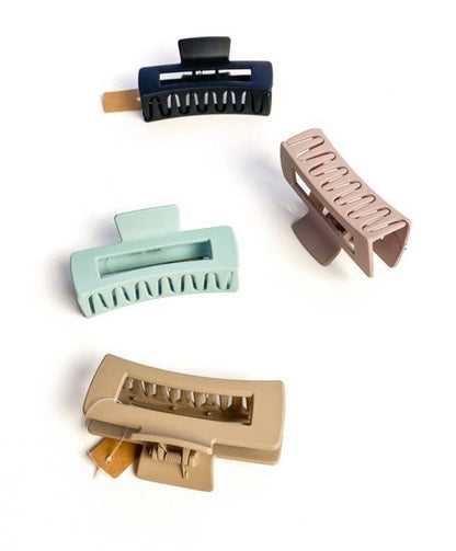 Sophie Matte Claw clip with a soft matte finish, available in black, camel, soft pink, and teal, designed to hold even the thickest hair