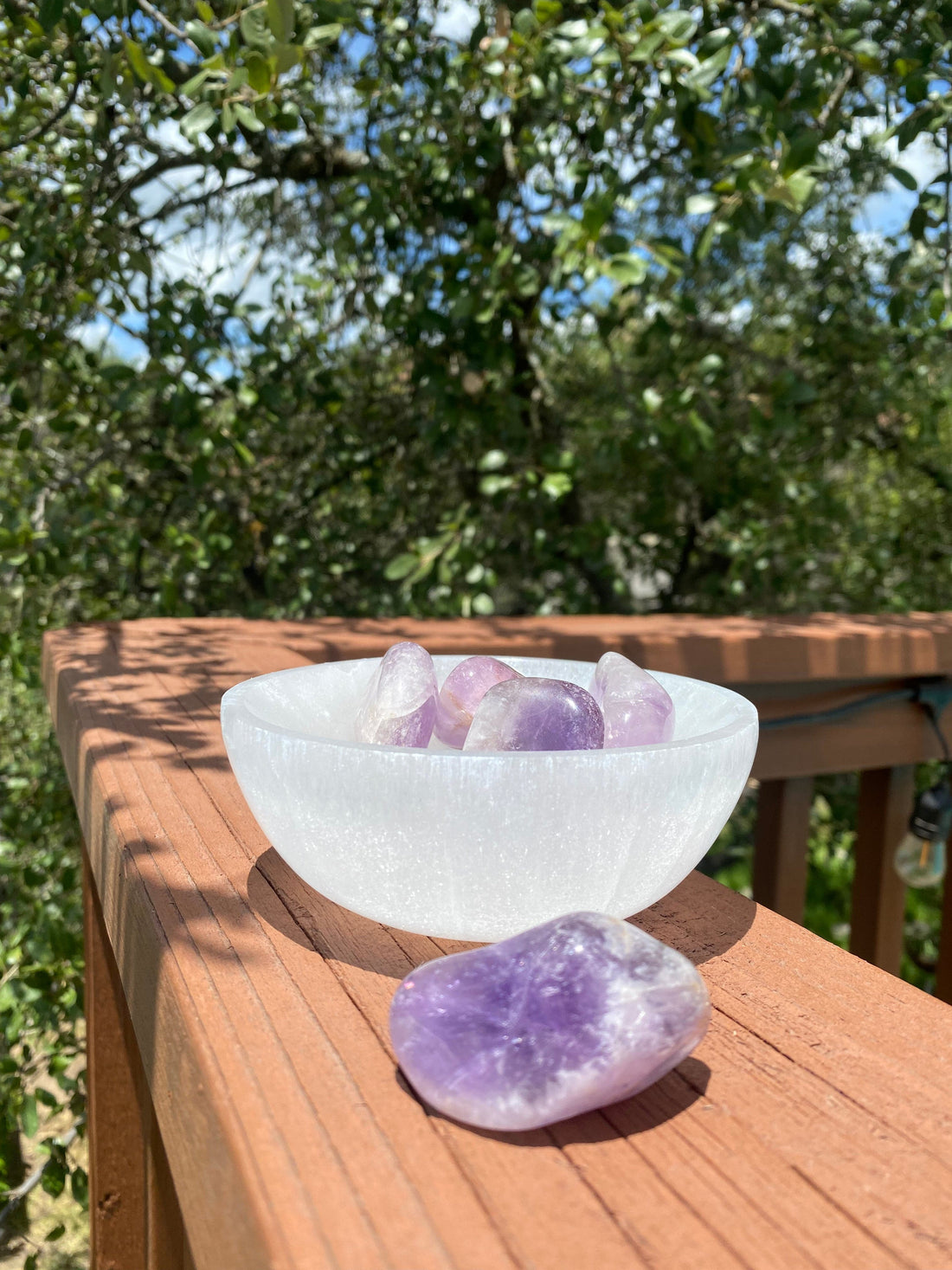 Natural Amethyst tumble stone, used for soothing irritability and balancing mood swings, linked to the crown chakra.