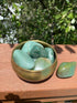 Green Aventurine tumble stone, known for its positive energy and healing properties, ideal for fostering confidence and achieving goals