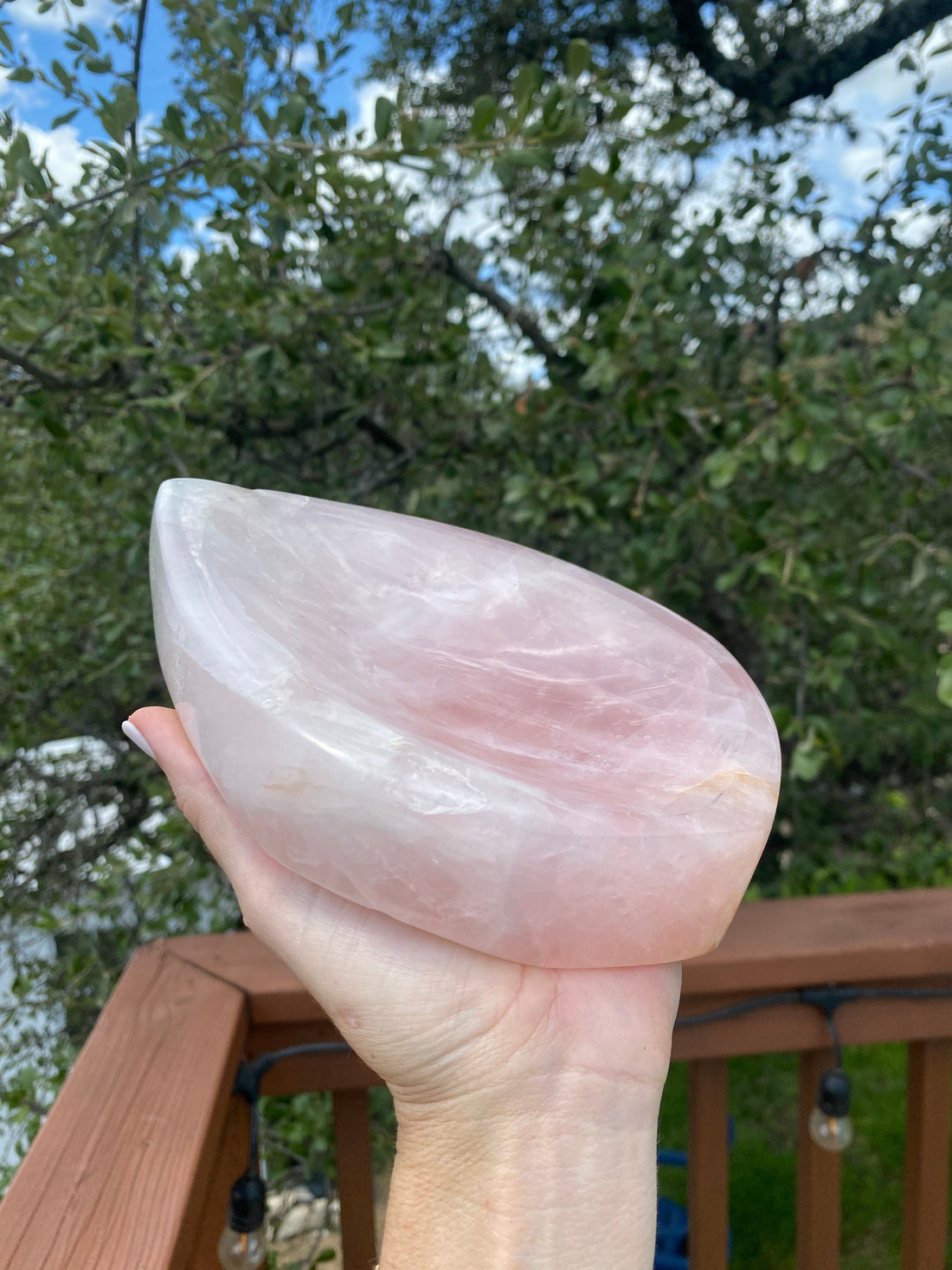 The Rose Quartz Bowl glows beautifully under the sun, revealing its soft pink tones, symbolizing love and harmony