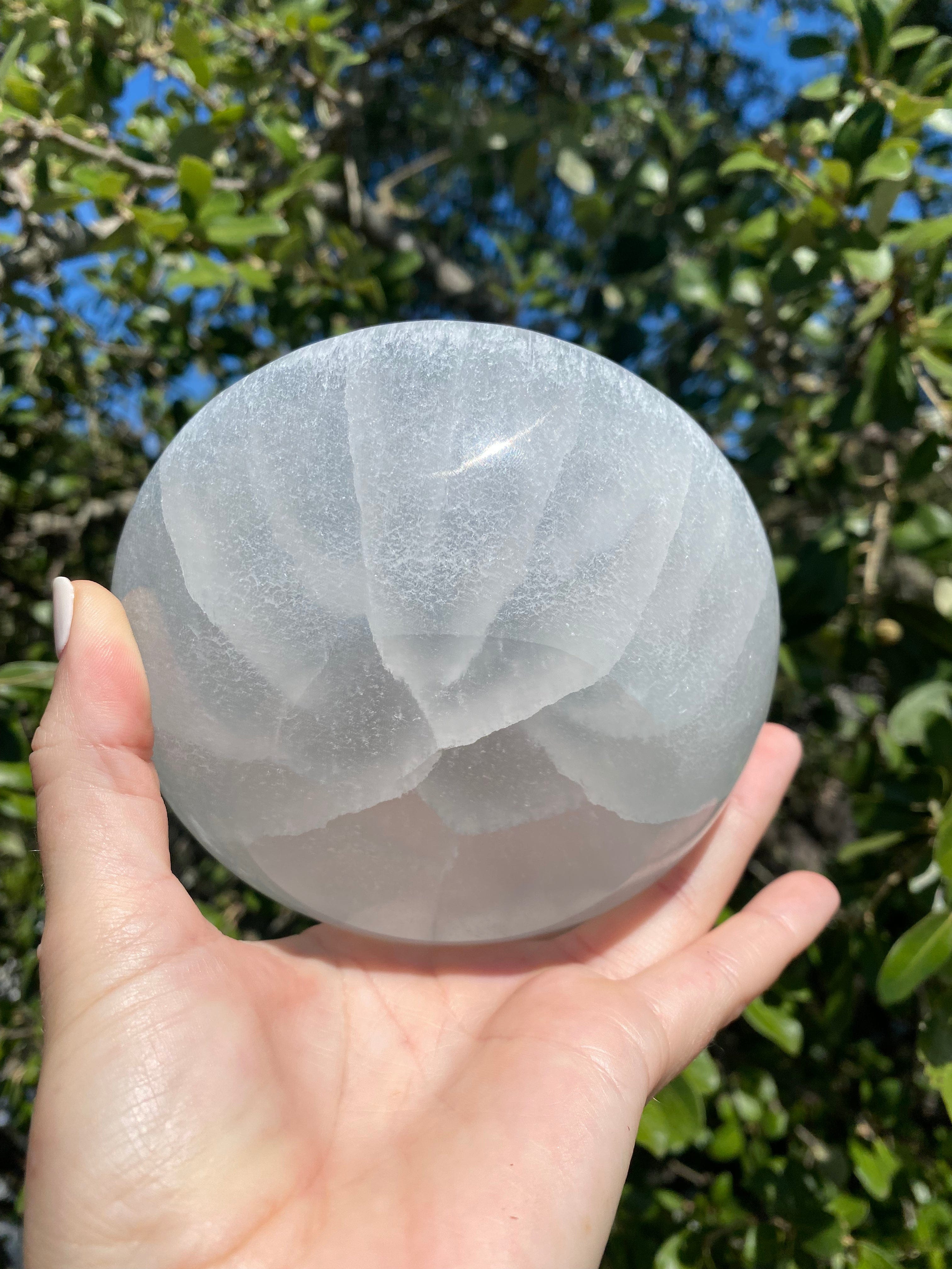 Hand polished Selenite Bowl, a powerful tool for holding and recharging crystals, promoting calmness and clarity in any collection