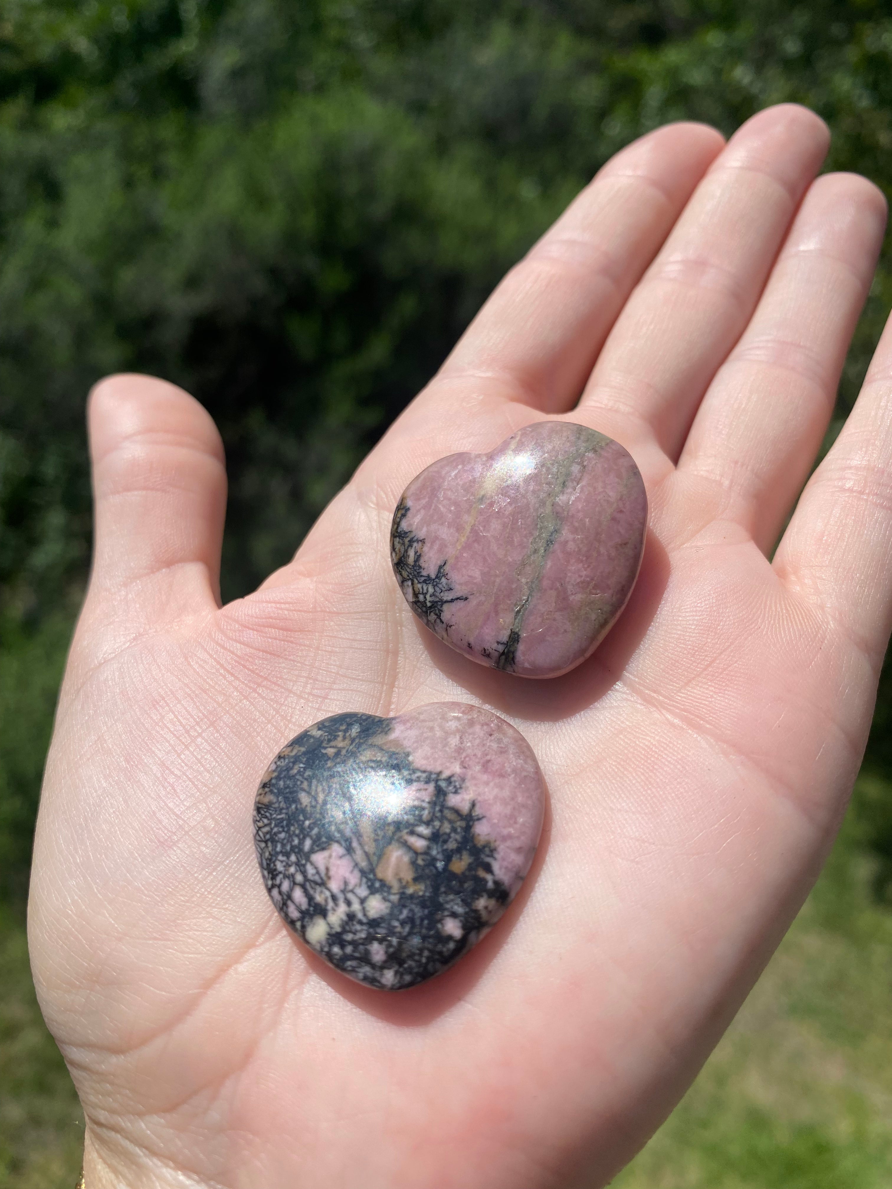 Rhodonite carved heart, stimulates and activates the heart, helping to clear emotional scars and ground energy for balance