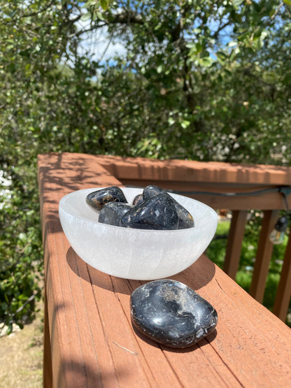 Protective Black Tourmaline tumbles, repelling negativity and transforming dense energy into a lighter vibration