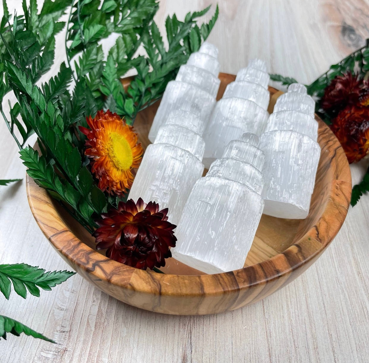 Selenite Tower carved with four tiers, ideal for promoting well-being, connecting to higher realms, and fostering a calming environment