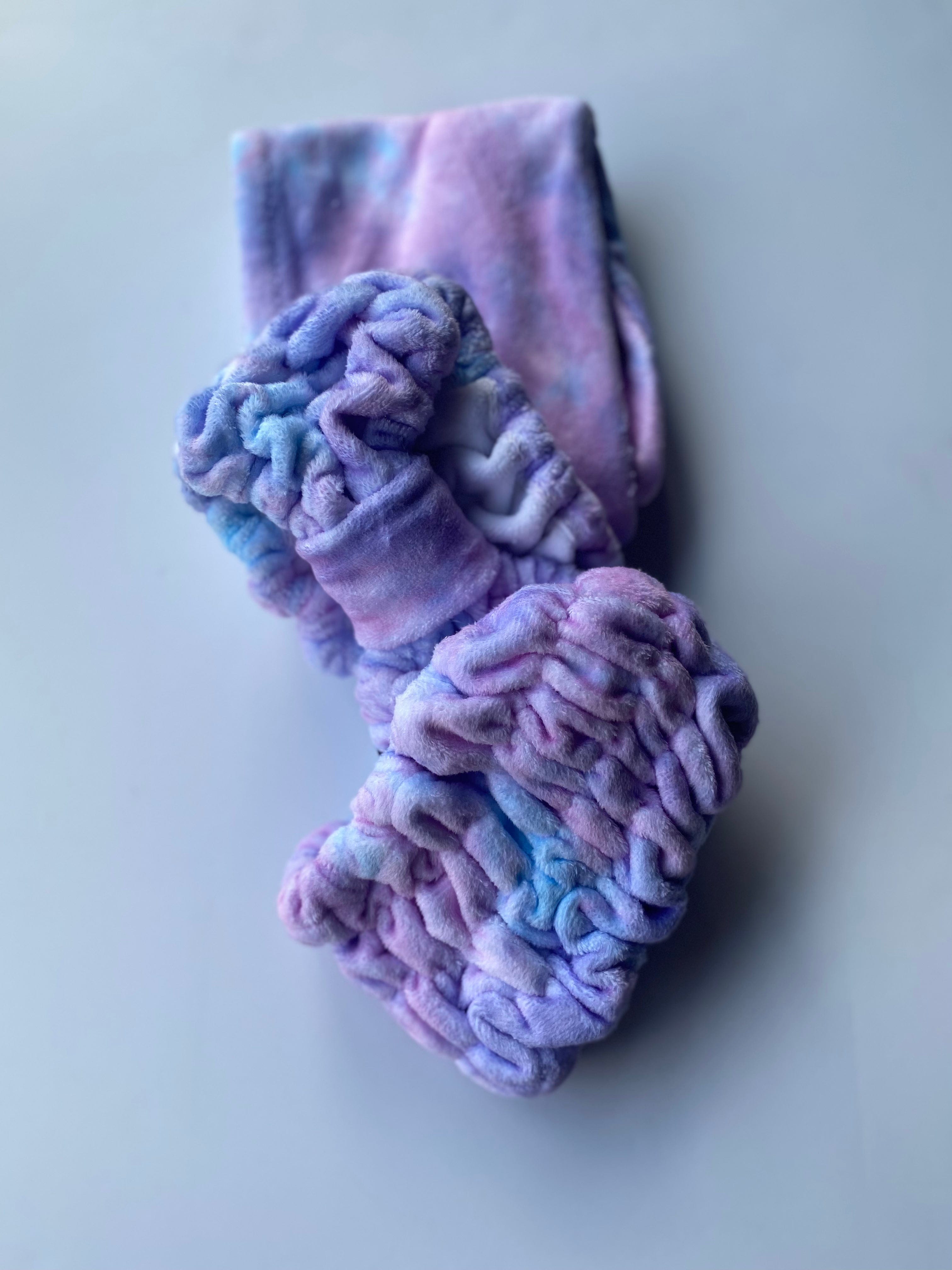 Purple tie-dye Stella Spa Headband offers a soft, plush microfiber feel, bringing comfort and a spa experience to your self-care