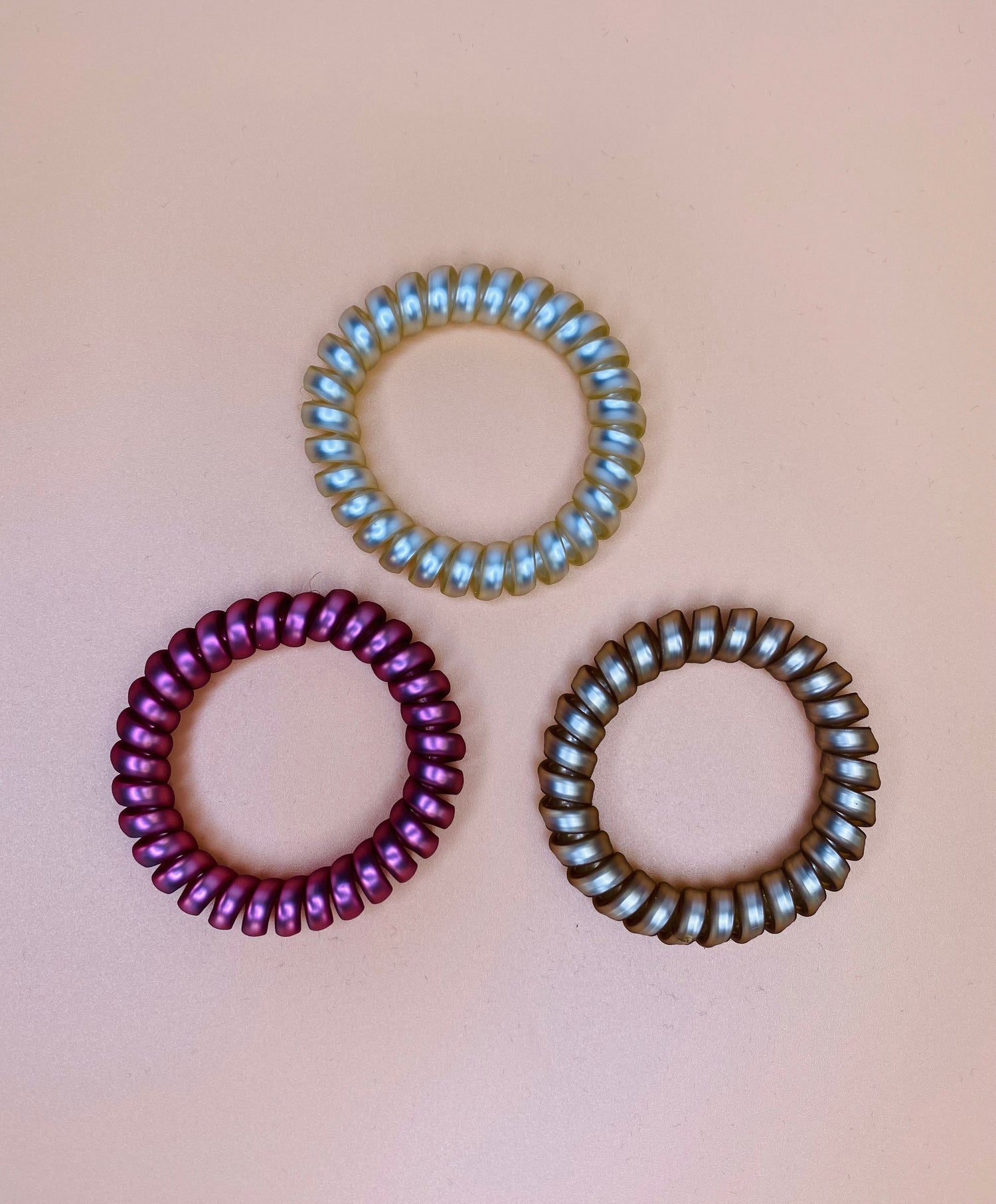 Rosé Coil Hair Ties, crease-less and ouch-less, perfect for all-day wear, comes in a set of 3 stunning colors for any hairstyle