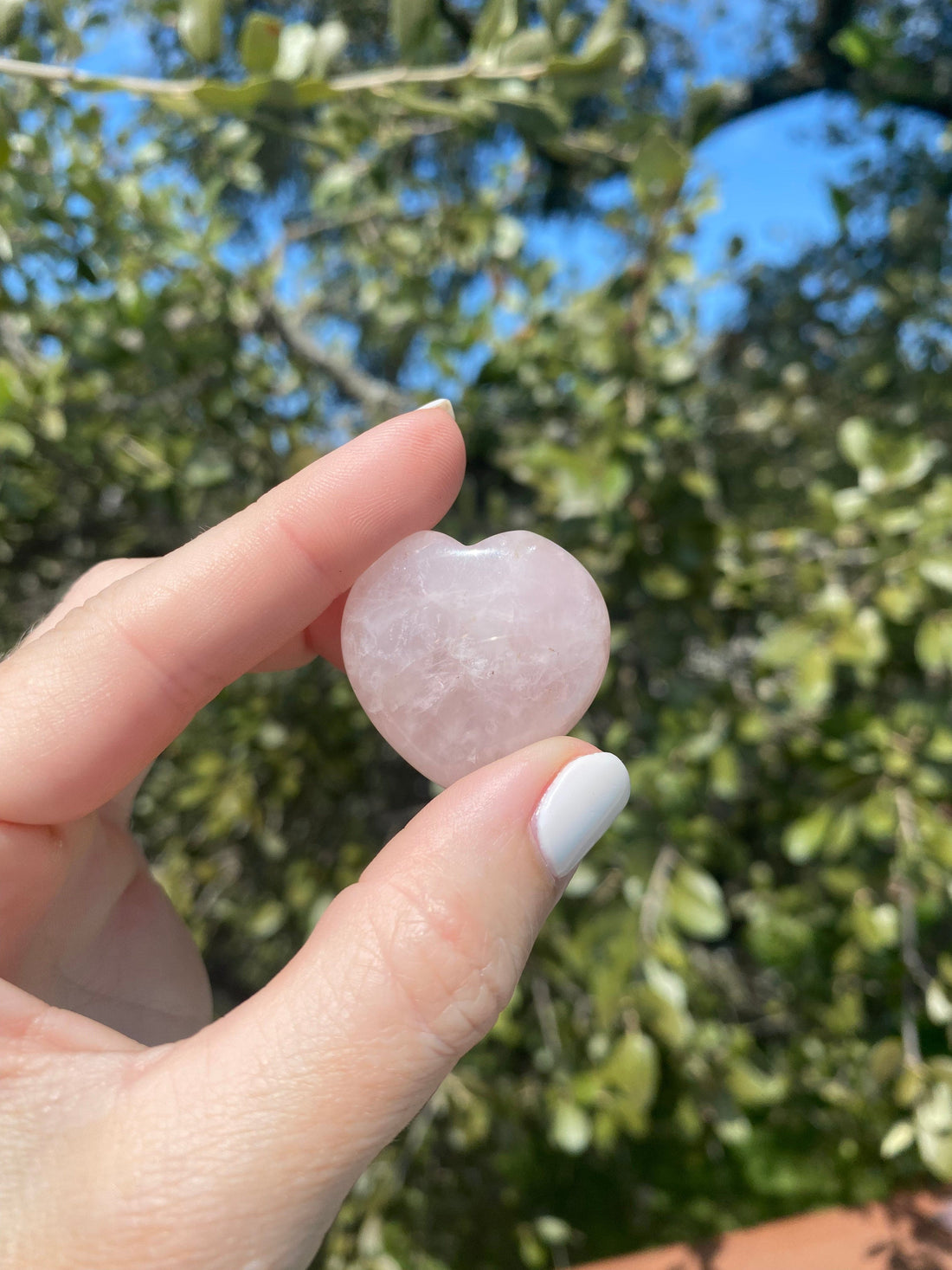 Held close, the Rose Quartz Pocket Heart shows smooth pink details, promoting love, healing, and compassion