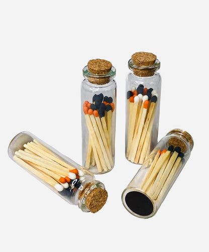 Candle Essentials matches with striker in Halloween orange and black, a festive accessory for lighting candles during the spooky season