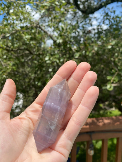 double-terminated fluorite crystal, absorbs negative energy, detoxifies the mind, and promotes clarity and peace with a calming energy