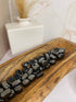 Hematite tumble stone, connected to the root chakra, perfect for grounding, balancing, and neutralizing negative energy