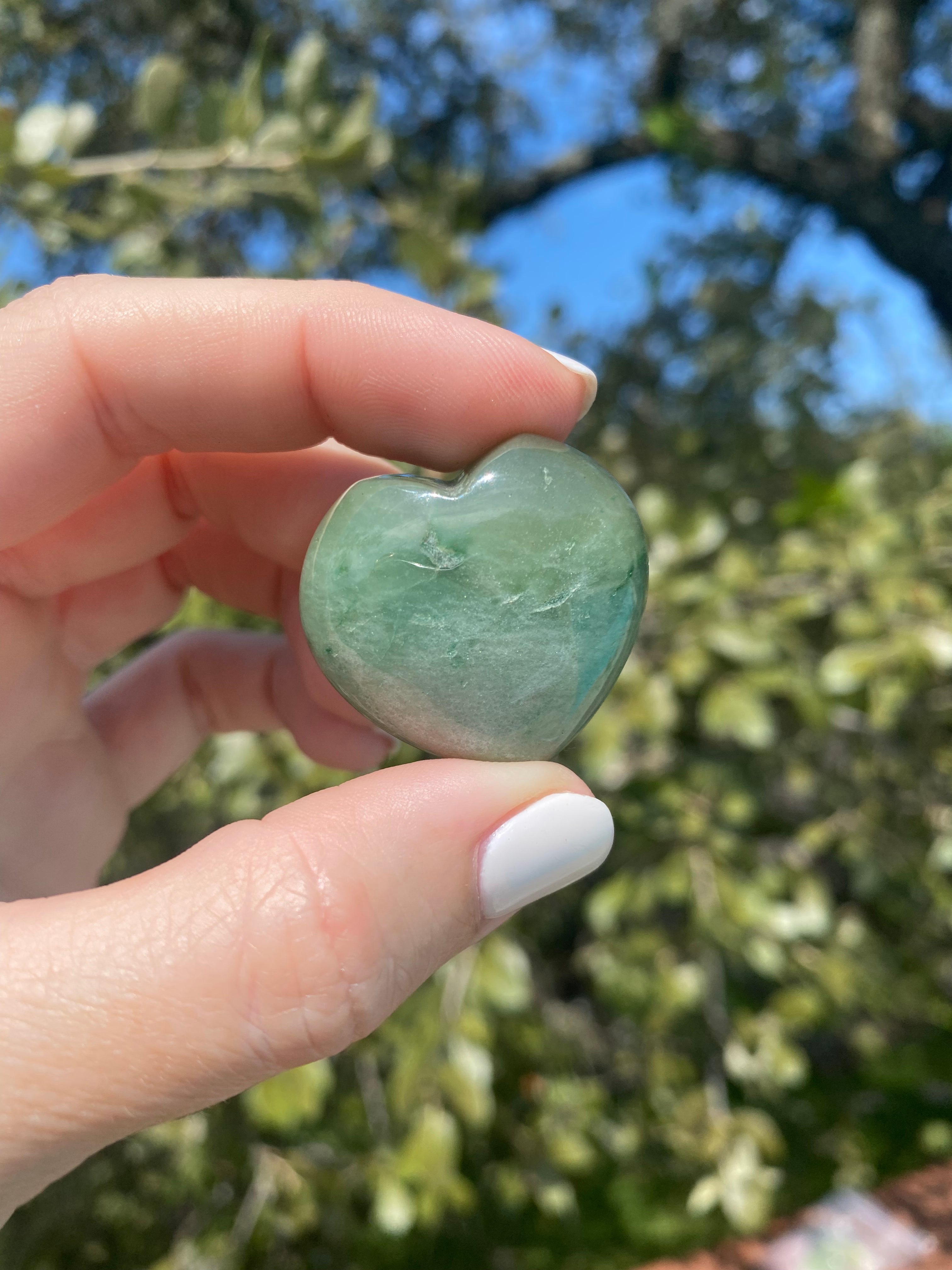 Green Aventurine pocket stone for heart chakra healing, known for boosting confidence and positive energy, perfect for good luck