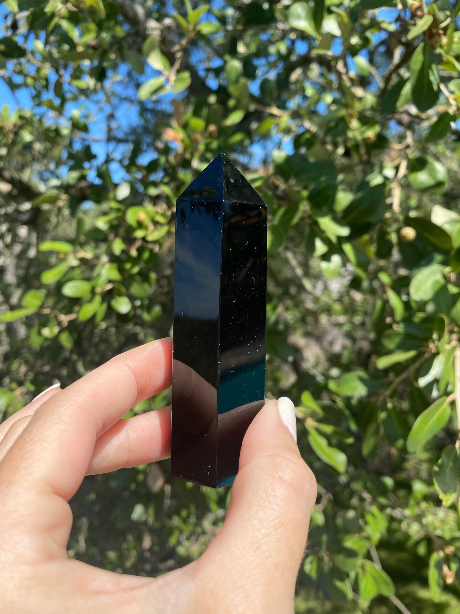 Polished Obsidian Tower, linked to Scorpio and Sagittarius, offers protection, draws out truth, and helps release emotional blockages
